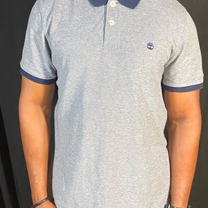 Blue Timberland Polo in a size large.